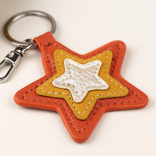 Pom faux leather star keyring - various colours